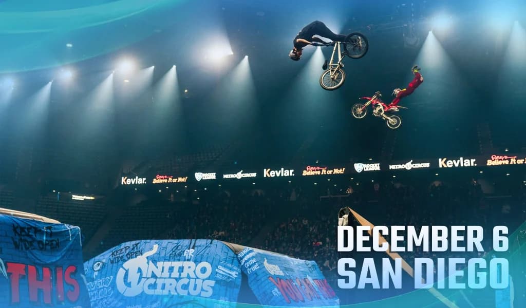 Two riders fly above arena ramps under spotlights with on-image text reading “December 6 San Diego”.